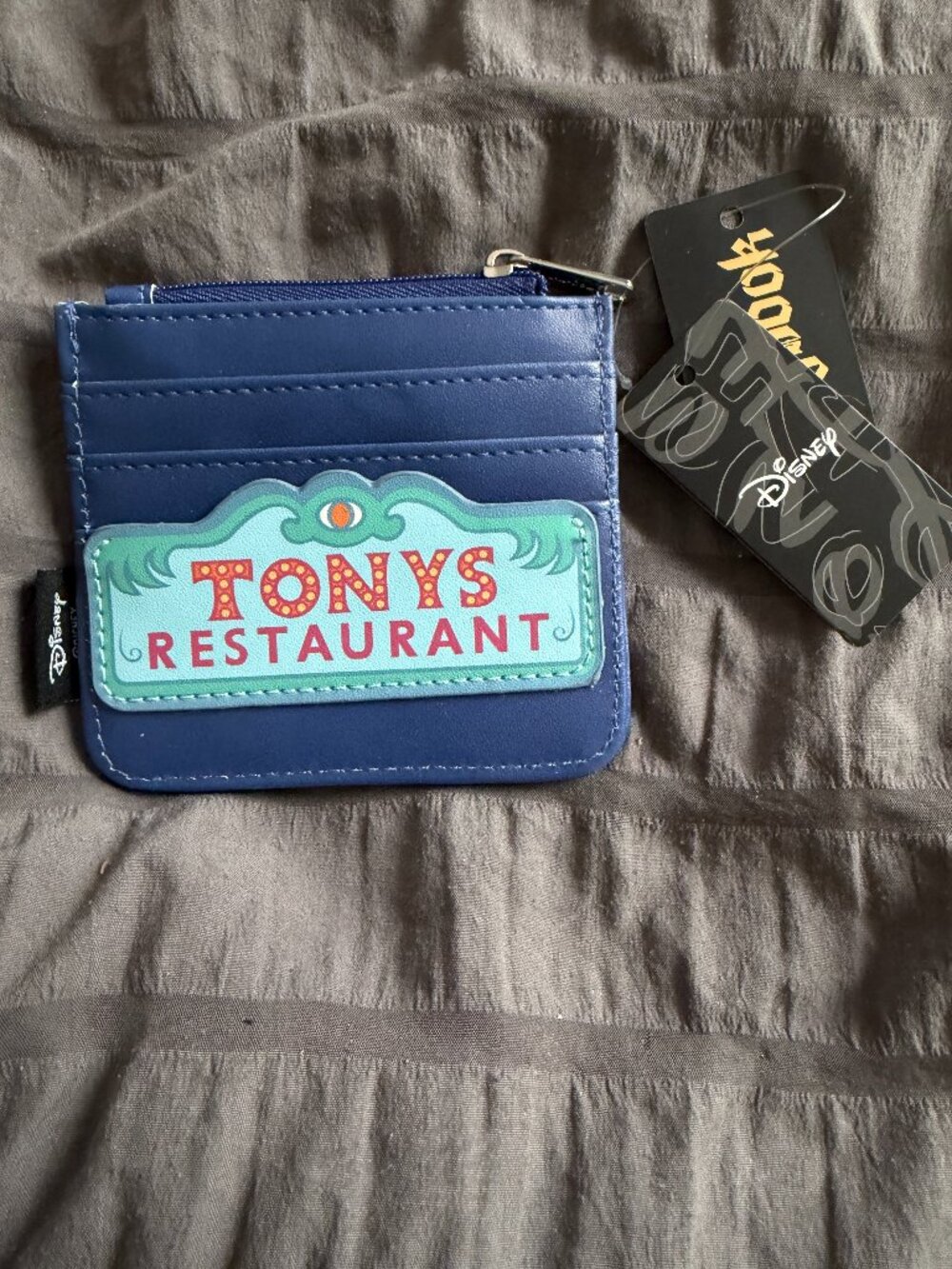 Disney Lady & Tramp Zip Cardholder features a Tony's Restaurant sign design